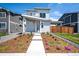 Charming two-story home with a modern design and beautifully landscaped front yard at 260 E 4Th St, Berthoud, CO 80513