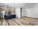 Open kitchen with stainless steel appliances, granite countertops, and an island with pendant lighting at 260 E 4Th St, Berthoud, CO 80513