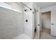 This bathroom features a tiled shower and a view to en-suite bathroom at 260 E 4Th St, Berthoud, CO 80513