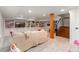 Spacious finished basement with built-in shelving, media center, and comfortable seating area at 890 S Vine St, Denver, CO 80209