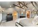 Spacious bedroom offers a neutral color scheme, exposed ceiling beams, and lots of closet space at 890 S Vine St, Denver, CO 80209