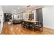 Elegant dining area featuring hardwood floors and contemporary lighting fixtures at 890 S Vine St, Denver, CO 80209