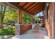 Inviting front porch with a porch swing and comfortable seating area at 890 S Vine St, Denver, CO 80209