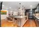 Modern open-concept kitchen featuring a large island and stainless steel appliances at 890 S Vine St, Denver, CO 80209