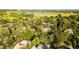 Aerial view of the neighborhood reveals the mature trees and lush lawns at 41 Skyline Dr, Wheat Ridge, CO 80215
