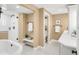 Luxurious bathroom with a soaking tub, a glass shower and stylish vanity at 41 Skyline Dr, Wheat Ridge, CO 80215