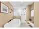 Elegant bathroom featuring a soaking tub and glass-enclosed tiled shower at 41 Skyline Dr, Wheat Ridge, CO 80215