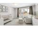 Comfortable Bedroom with crib, chair, and view to the outdoors at 41 Skyline Dr, Wheat Ridge, CO 80215