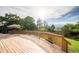 Wood deck with railing provides outdoor relaxation space and views of the backyard at 41 Skyline Dr, Wheat Ridge, CO 80215