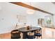 Modern dining room with hardwood floors, statement lighting and neutral decor at 41 Skyline Dr, Wheat Ridge, CO 80215