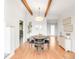 Bright dining room showcasing hardwood floors, modern decor, and beamed ceilings at 41 Skyline Dr, Wheat Ridge, CO 80215