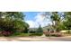 Charming home featuring well-maintained landscaping, colorful flowers, and mature trees at 41 Skyline Dr, Wheat Ridge, CO 80215