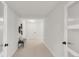Well-lit hallway with doors and neutral decor at 41 Skyline Dr, Wheat Ridge, CO 80215