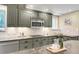 Close-up of kitchen featuring granite countertops, modern appliances, and ample counter space at 41 Skyline Dr, Wheat Ridge, CO 80215