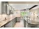 Spacious kitchen featuring an island, stainless-steel appliances, and hardwood floors at 41 Skyline Dr, Wheat Ridge, CO 80215