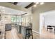Spacious kitchen featuring a center island, light wood floors, and beamed ceilings at 41 Skyline Dr, Wheat Ridge, CO 80215