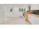 Bright laundry area with wooden countertops, modern machines, and natural light at 41 Skyline Dr, Wheat Ridge, CO 80215