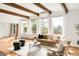 Light-filled living area boasting hardwood floors, mountain views, and a neutral color palette at 41 Skyline Dr, Wheat Ridge, CO 80215