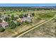 Expansive aerial view of a blue two-story home with easy access to highway and nearby walking trails at 8915 S Field Ct, Littleton, CO 80128