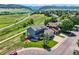 Aerial view of a charming home with beautiful landscaping, nestled in a picturesque neighborhood with mountain views at 8915 S Field Ct, Littleton, CO 80128