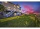 Grassy backyard featuring a two-story house with a spacious deck, perfect for outdoor entertaining and relaxation at 8915 S Field Ct, Littleton, CO 80128