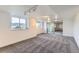 Finished basement showcasing plush carpet and a large sliding glass door, perfect for additional living space at 8915 S Field Ct, Littleton, CO 80128