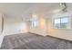 Spacious basement featuring neutral carpet, recessed lighting, and windows with scenic views at 8915 S Field Ct, Littleton, CO 80128