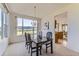Bright dining room with scenic views and elegant furnishings at 8915 S Field Ct, Littleton, CO 80128