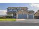 Charming two-story home with a stone facade and well-maintained landscaping at 8915 S Field Ct, Littleton, CO 80128