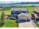 Stunning two-story home with a three-car garage and beautiful mountain views at 8915 S Field Ct, Littleton, CO 80128