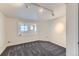 Versatile flex room with carpet, a window with mountain views and neutral walls at 8915 S Field Ct, Littleton, CO 80128