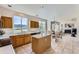 Bright eat-in kitchen with an island, open layout, and mountain views at 8915 S Field Ct, Littleton, CO 80128