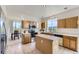 Eat-in kitchen with an island, lots of natural light, and an adjacent dining area at 8915 S Field Ct, Littleton, CO 80128