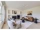 Bright living room featuring a fireplace, plush seating, and stylish decor at 8915 S Field Ct, Littleton, CO 80128