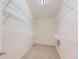 Bright walk-in closet with carpeted floor and multiple wire shelving units for optimal storage solutions at 8915 S Field Ct, Littleton, CO 80128
