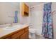 Clean bathroom with shower/tub combo and wood vanity at 3711 Bucknell Cir, Highlands Ranch, CO 80129