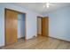 Bedroom with hardwood floors and double door closet at 3711 Bucknell Cir, Highlands Ranch, CO 80129