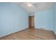 Light blue bedroom with hardwood floors and ceiling fan at 3711 Bucknell Cir, Highlands Ranch, CO 80129