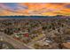 An aerial view of the property highlights its location and neighborhood with scenic mountain backdrop at 12024 W Maryland Dr, Lakewood, CO 80228