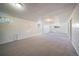 Expansive basement featuring neutral carpet, white wainscoting, and recessed lighting at 12024 W Maryland Dr, Lakewood, CO 80228