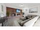 Finished basement features a brick fireplace, a TV, and a cozy seating area at 12024 W Maryland Dr, Lakewood, CO 80228
