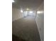 Spacious basement featuring carpeting and white walls at 12024 W Maryland Dr, Lakewood, CO 80228