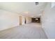 Spacious finished basement with neutral carpet, white walls, and a cozy brick fireplace perfect for entertaining at 12024 W Maryland Dr, Lakewood, CO 80228