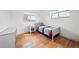 Bedroom featuring hardwood floors, and a window allowing natural light at 12024 W Maryland Dr, Lakewood, CO 80228