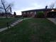 Charming single-story brick home with a well-maintained lawn and an attached one car garage at 12024 W Maryland Dr, Lakewood, CO 80228