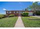 Charming brick ranch home with a well-maintained lawn and mature landscaping in a desirable neighborhood at 12024 W Maryland Dr, Lakewood, CO 80228