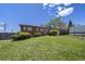 Classic brick home with a green lawn and shrubbery in a sunny suburban setting at 12024 W Maryland Dr, Lakewood, CO 80228