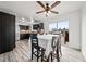 Open concept eat in kitchen features stainless appliances and updated cabinetry at 12024 W Maryland Dr, Lakewood, CO 80228