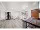 Bright living room featuring neutral walls, wood flooring, and modern furniture at 12024 W Maryland Dr, Lakewood, CO 80228