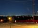 Scenic nighttime view with city lights twinkling on the horizon at 12024 W Maryland Dr, Lakewood, CO 80228